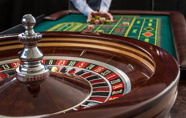 Multiple Ikan Jackpot tables showing live game action with dealers and players